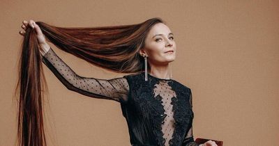 Woman with over 5ft-long hair says strangers are constantly asking to touch it