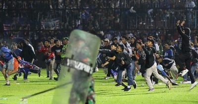 Indonesia football stampede: At least 125 fans dead following pitch invasion as sport in 'state of shock'