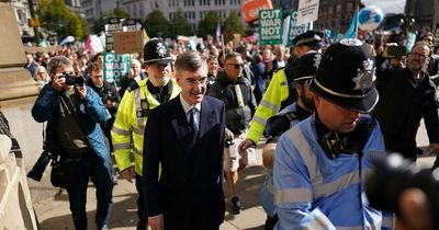 Jacob Rees-Mogg booed by protesters shouting 'Tory scum' as he arrives at party conference