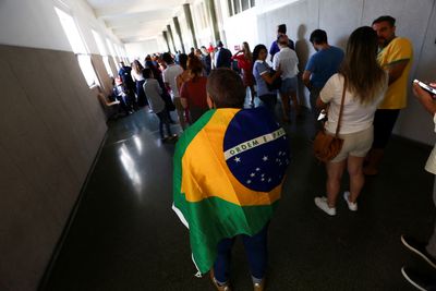 Tensions high as Brazilians on other side of Atlantic cast ballots