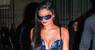 Kylie Jenner stuns in plunging blue vinyl corset dress at Paris Fashion Week