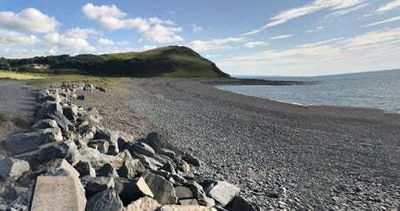 Walker discovers ‘£90m’ haul of cocaine washed up on Welsh beach