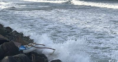 Rescue after outrigger smashes into rocks at Stockton