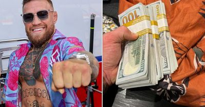 Conor McGregor shows off wads of $100 notes in latest confusing message