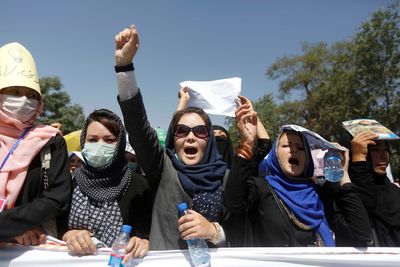 Afghan women protest school attack as Taliban cracks down