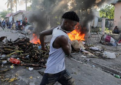Haitian police fire tear gas as thousands protest against government
