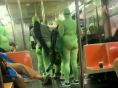 Six women in neon green jumpsuits rob and beat two women on NYC subway