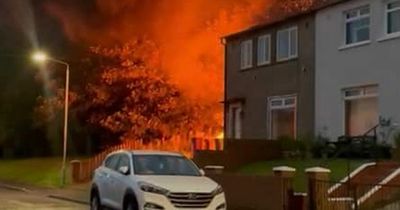 Huge blaze towers over Scots home after 'abandoned caravan' catches fire