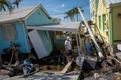 Biden heads into Florida hurricane clean-up zone -- and opponent's territory