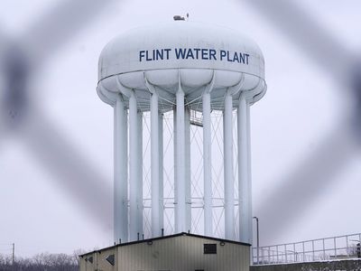 A Michigan judge drops felony charges against 7 people in Flint water scandal