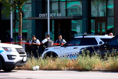 Officer shoots armed man inside Chicago police station