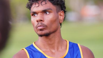 Darwin footballer Lloyd Johnston is determined to pursue his dream of an AFL career, despite allegations of racism in the league