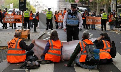 Just Stop Oil activists arrested after glueing themselves to road in Whitehall