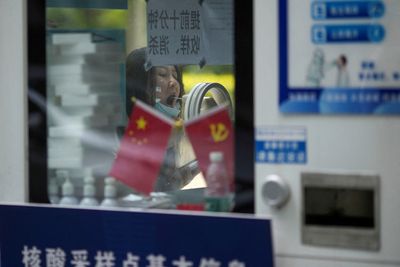 Analysis-As China party congress looms, signals sought on easing COVID policy