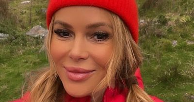 Amanda Holden hikes in full face of makeup and jokes she has high heels in bag