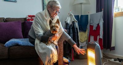 Scots OAP too scared to turn on gas heating curls up with dog to stay warm