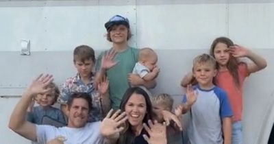 Family live full time in a converted school bus - with their seven children