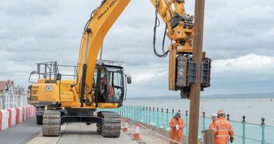 Council claims 'most disruptive parts' of controversial sea wall are finished