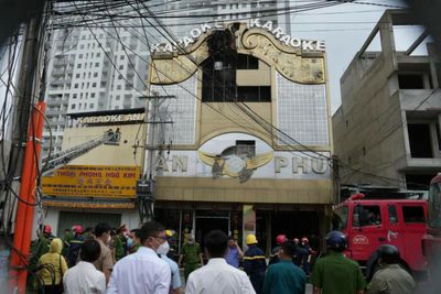 Two police officers arrested in Vietnam after blaze killed 32