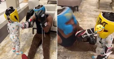 Floyd Mayweather pretends to be KO'd by one-year-old grandson in adorable video