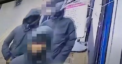 Police issue update after up to a dozen masked youths storm barber shop and violently attack teenager