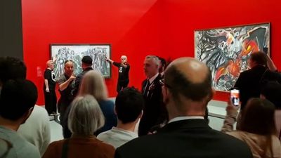Protesters arrested after gluing themselves to Picasso painting at NGV in Melbourne