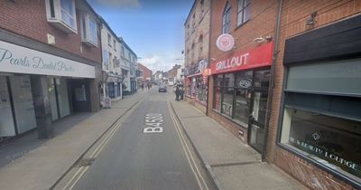 Man arrested on suspicion of murder after woman dies after being hit by car outside takeaway