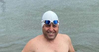 Dad rushed to hospital after swimming for 22 hours straight in freezing waters
