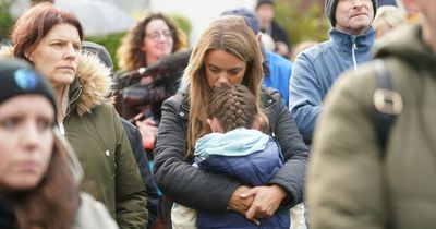 Parents hug children at sombre vigil for 10 people killed in Ireland petrol station blast