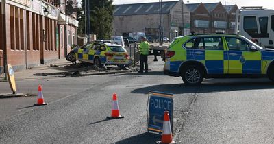 Road cordoned off for hours after police car crash with Audi