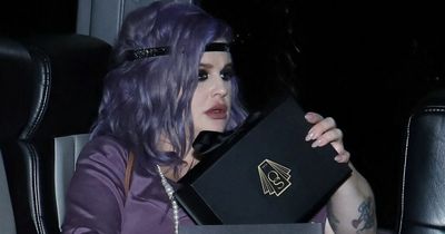 Kelly Osbourne shows off her baby bump at family party for mum Sharon's 70th birthday