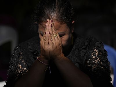 Families bid farewell as Thai massacre victims are cremated