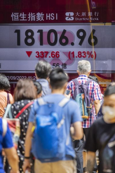 Hong Kong shares dive to 11-year low as China touts ‘zero COVID’