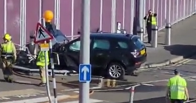 Man charged after car crashes through railings at Edinburgh Airport