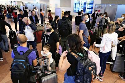 Tokyo airports bustle as entry restrictions eased for tourists