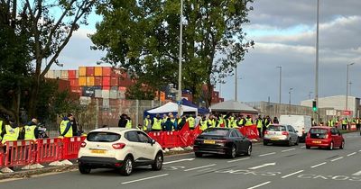 Defiant dock workers return to picket line as port bosses threaten job cuts