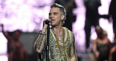 Robbie Williams' cheeky quip as he's flashed by excited fan at first show of comeback tour