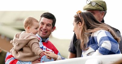 Robbie Dunne all smiles celebrating comeback winner with baby daughter at Hereford