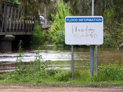 Man dies in floodwaters, more rain for NSW