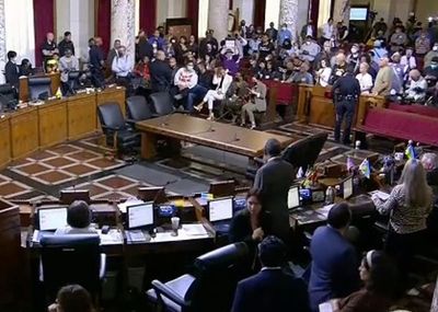 Biden calls for LA council members to quit over racism scandal as chaos breaks out at city meeting
