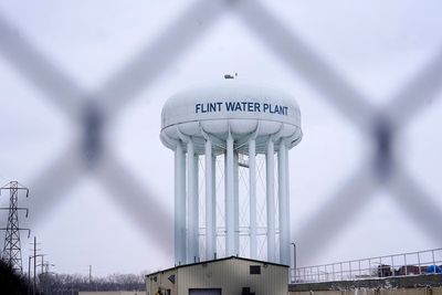 Ex-Michigan governor asks court to drop Flint water charges
