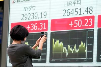 Asian shares mixed ahead of inflation, earnings reports
