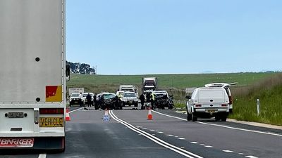 Barton Highway re-opens after woman dies and man is seriously injured in two-car crash near Yass