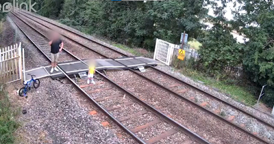 Man leaves toddler to wander on train tracks while he talks on phone