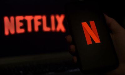 Netflix launches £4.99 package with adverts to lure cost-conscious streamers