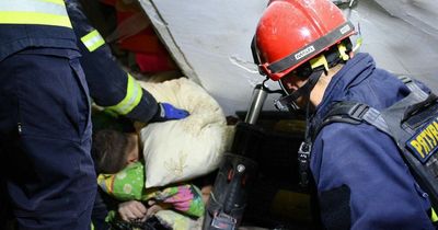 Miracle moment Ukrainian rescuers save boy trapped under rubble for six HOURS after blast