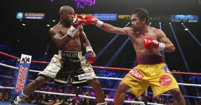 Manny Pacquiao accuses Floyd Mayweather of being "scared to death" of rematch