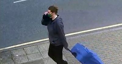 Woman accused of 'killing and decapitating friend' seen on CCTV dragging heavy suitcase