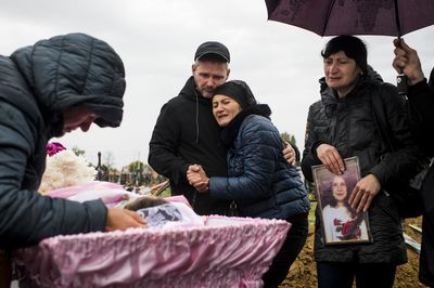 Ukrainians grieve for an 11-year-old girl killed by a Russian missile