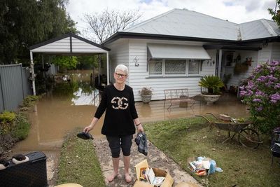 ‘Just too much rain’: small-town Australians survey damage after massive flooding